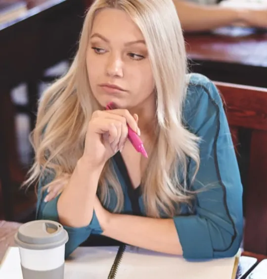 Three older teenager students revising together.