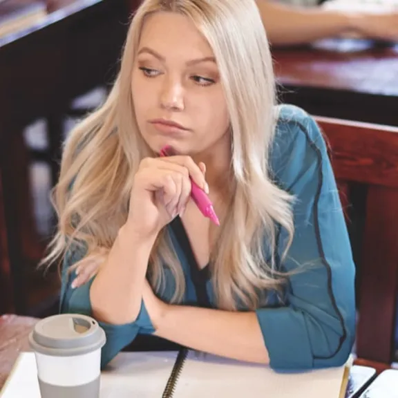 Three older teenager students revising together.