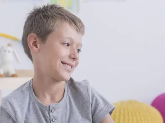 Mother and son, of a young age, studying together.