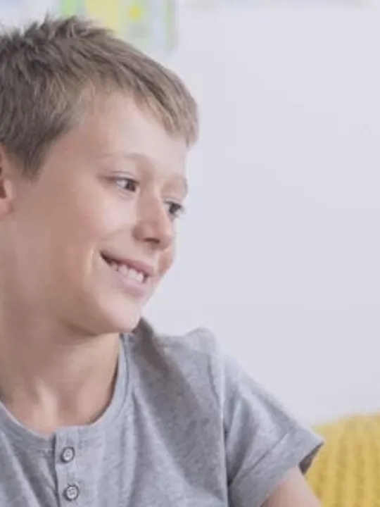 Mother and son, of a young age, studying together.