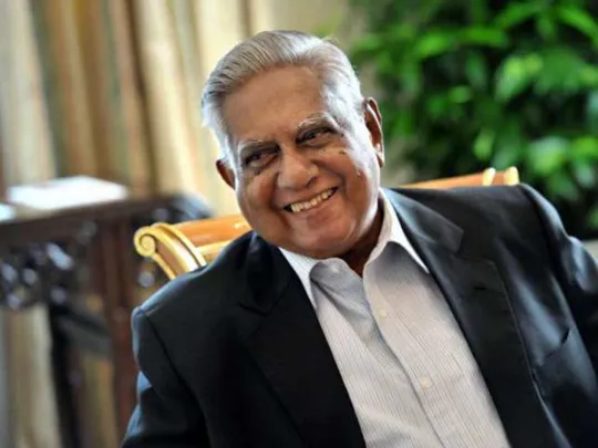 A photograph of Wolsey Hall Oxford alumnus SR Nathan, former President of Singapore. SR Nathan is sitting and smiling at someone off-camera and is wearing a suit with no tie, with short, combed-back grey hair.