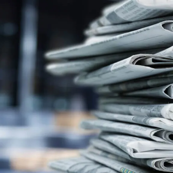 A stack of newspapers folded on top of each other.