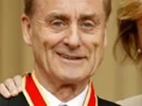 A close-up photograph of Wolsey Hall Oxford alumnus Sir Harold Evans, ex-editor of the Sunday Times, who studied economics with us whilst serving as an airman in the RAF. Harold is smiling at the camera and wearing formal attire.