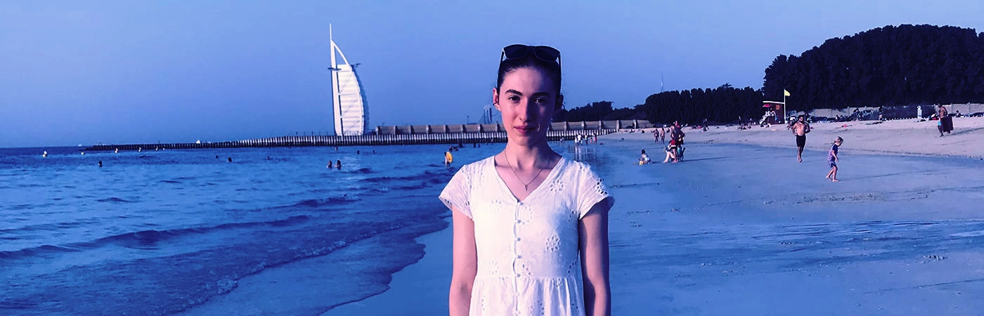 Wolsey Hall Oxford student, Evangelista, on a beach. 