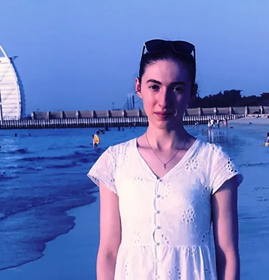 Wolsey Hall Oxford student, Evangelista, on a beach.