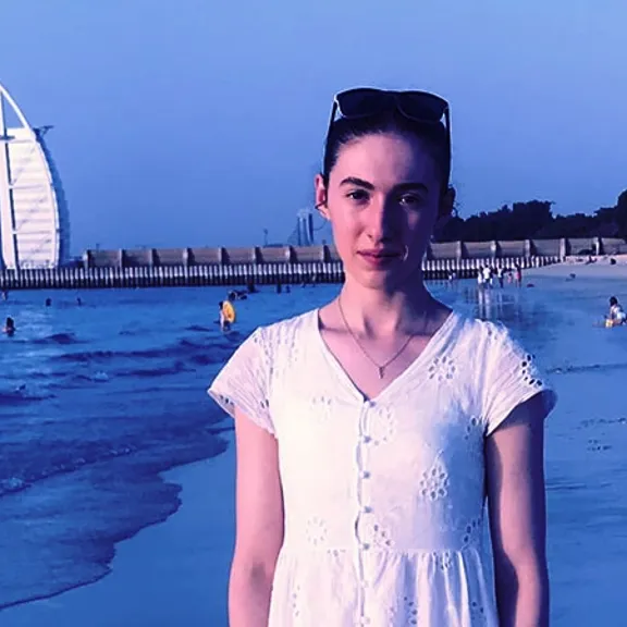 Wolsey Hall Oxford student, Evangelista, on a beach.