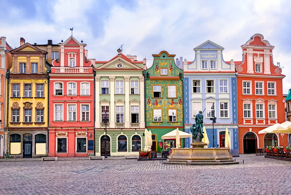 A landscape view of a variety of colourful and beautifully designed Polish buildings. 
