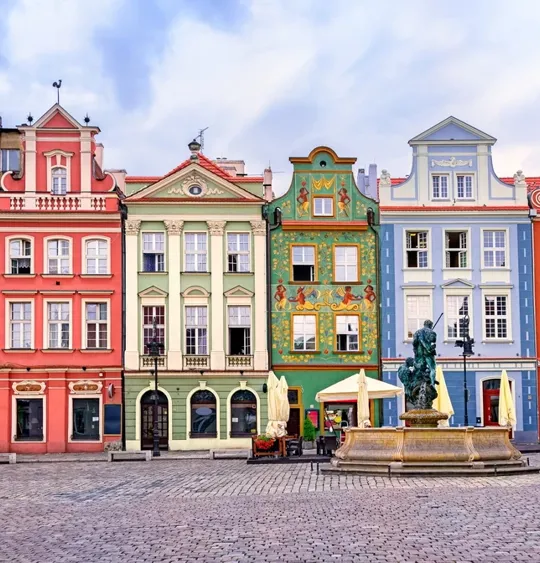 A landscape view of a variety of colourful and beautifully designed Polish buildings.