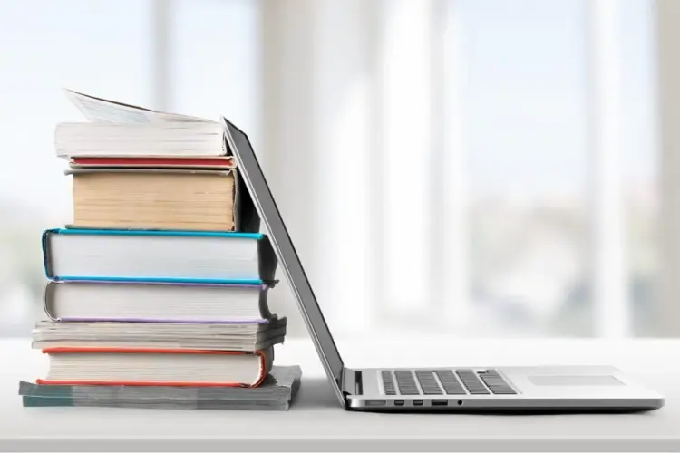 Laptop and books