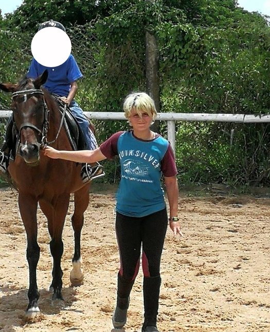 Wolsey Hall Oxford student, Reine, with a horse. 