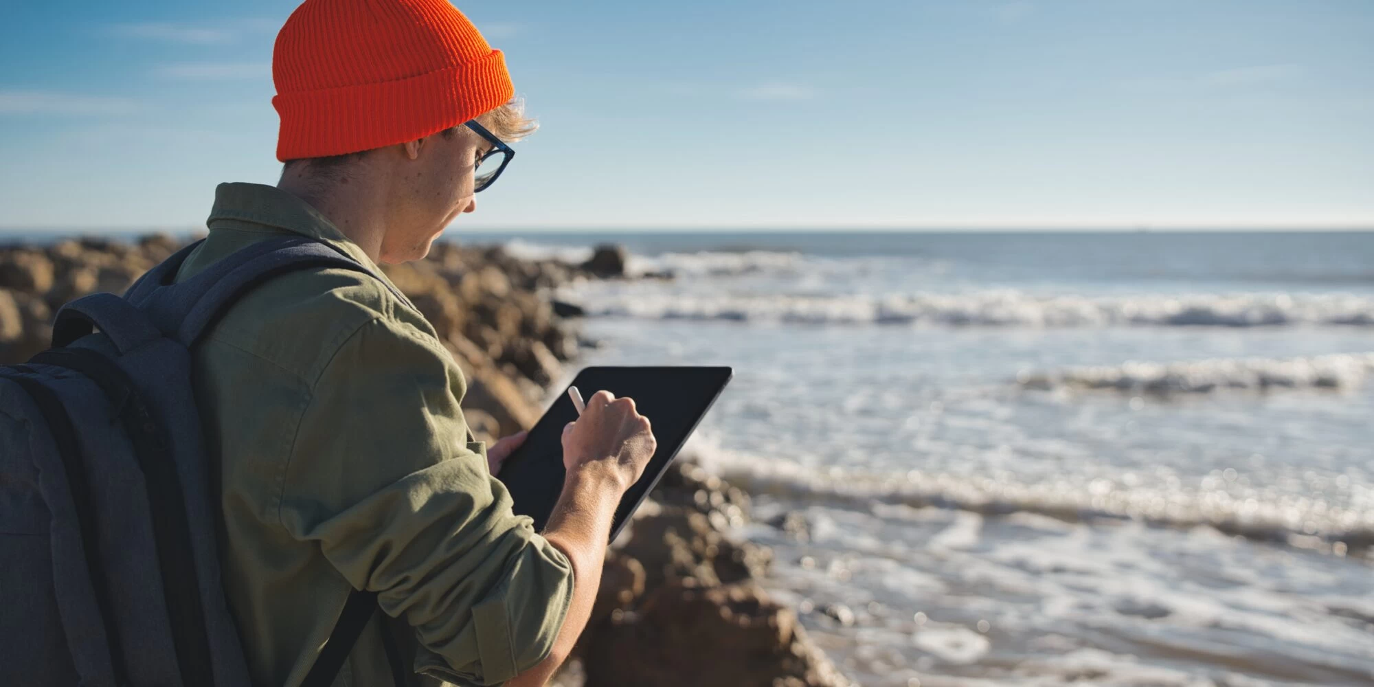 Marine scientist observing the sea and making note of their findings. 