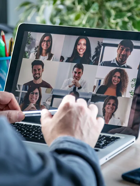 A team of online education professionals collaborating during a video conference call.