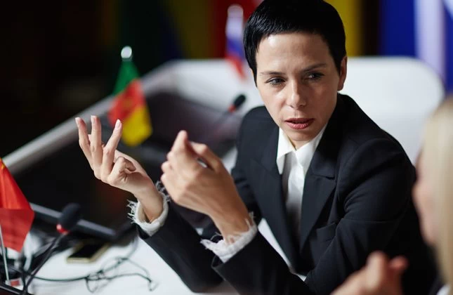 A country leader speaking at a political conference. 