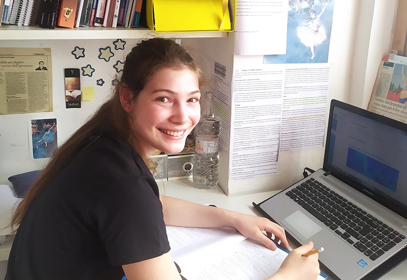 Wolsey Hall Oxford student, Sofia, working at her desk. 