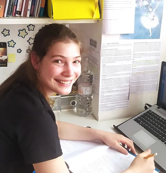 Wolsey Hall Oxford student, Sofia, working at her desk.