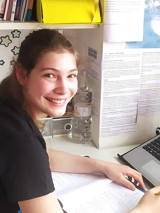 Wolsey Hall Oxford student, Sofia, working at her desk.