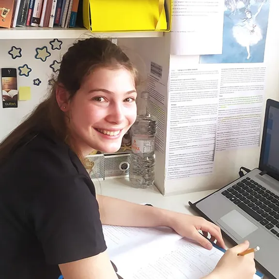Wolsey Hall Oxford student, Sofia, working at her desk.