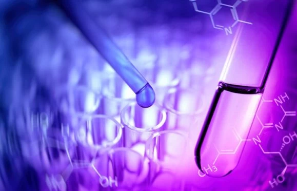 A close up of a scientific test tube. With digitalised graphics and a purple and pink hue. 