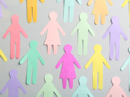 Cutouts of different coloured paper people.