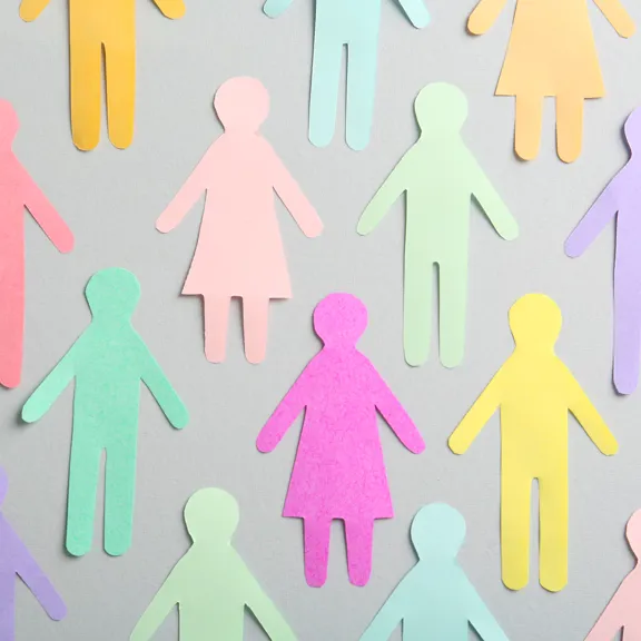 Cutouts of different coloured paper people.