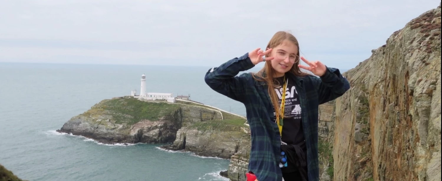Wolsey Hall Oxford student, Lily, on a cliff. 