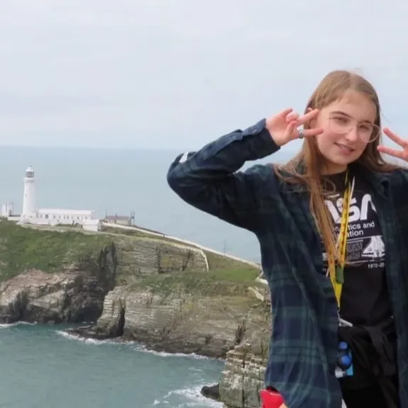 Wolsey Hall Oxford student, Lily, on a cliff.