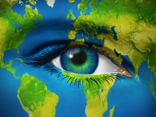 Artistic illustration of a human eye blended into a world map, symbolising global awareness.