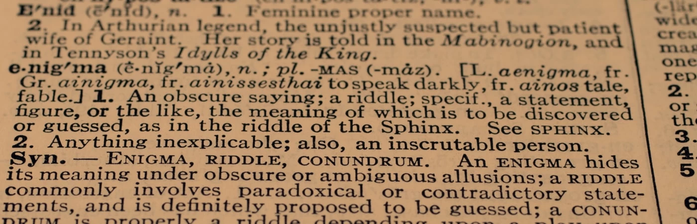 Close up of 'enigma' definition, highlighting the importance of language. 