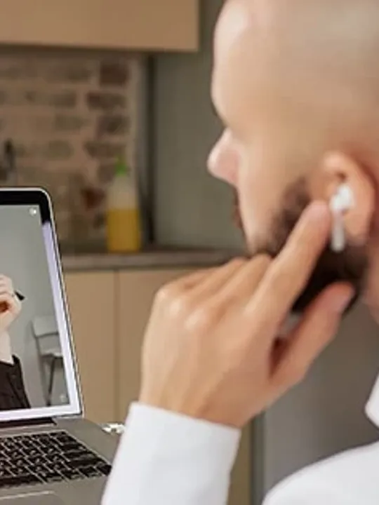 An adult learners on a face call with other students.