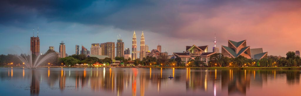 Landscape view of the Kuala Lumpur skyline, with a scenic and colourful sky. 