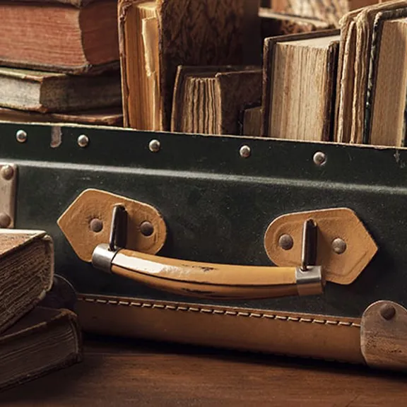 A suitcase with books inside.