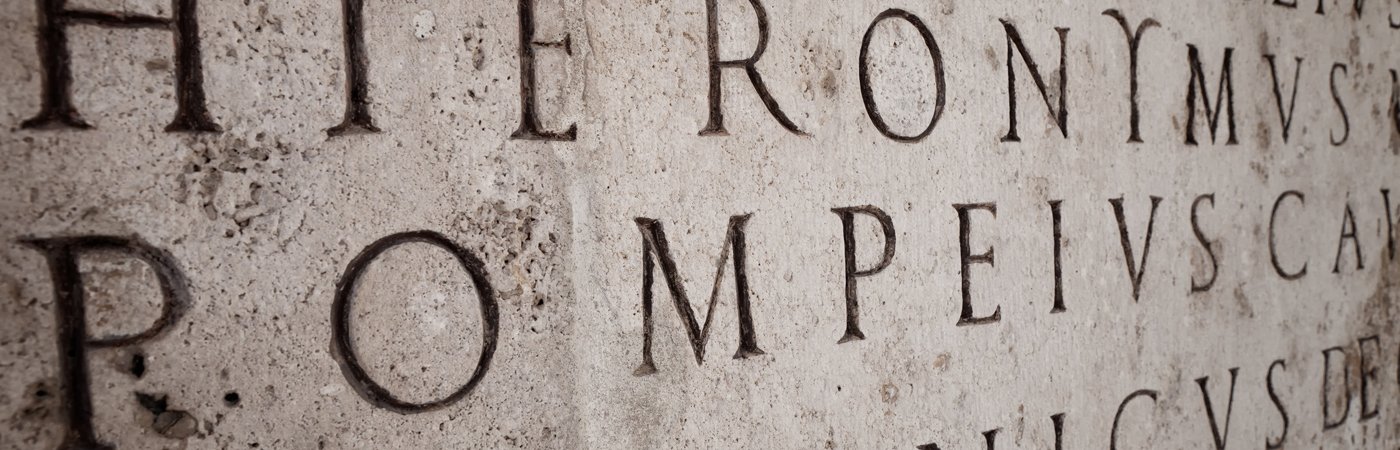 Old stone engraved with latin words. 