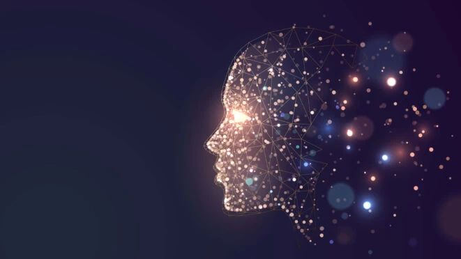 A face created by colourful pixels slowly fading out. 