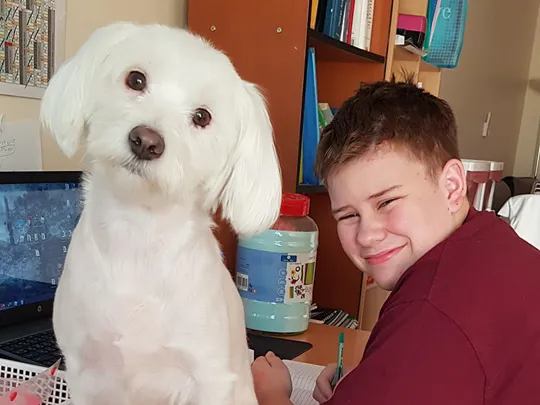 Wolsey Hall Oxford student, Kaelem, and his dog.