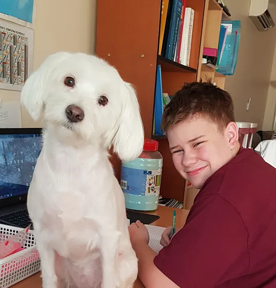 Wolsey Hall Oxford student, Kaelem, and his dog.