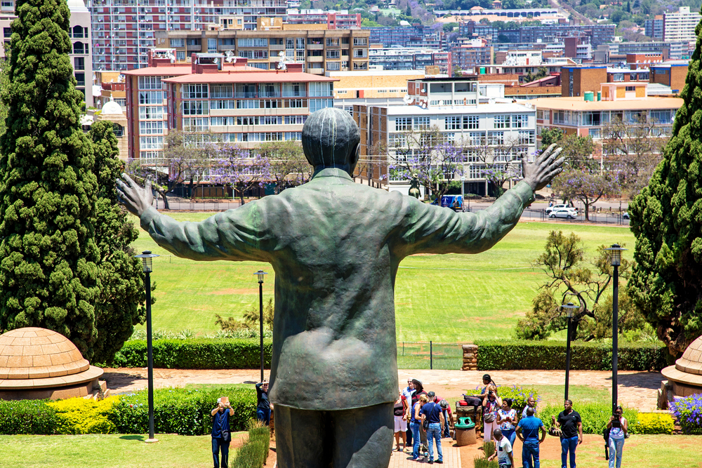 The iconic Nelson Mandela statue with arms outstretched at the Union Buildings in Pretoria, a significant site for educational outings for homeschooling families.