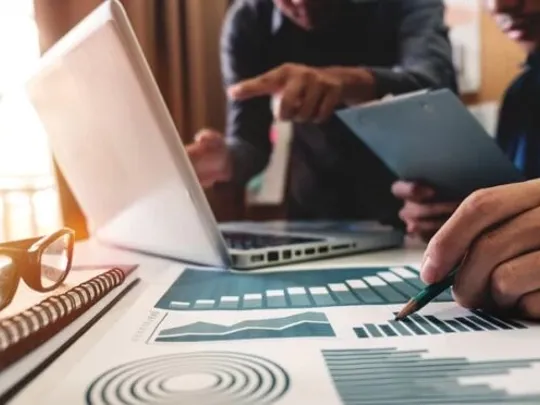 Economics students studying data chats as part of their course.