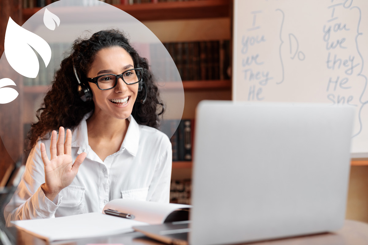 A friendly and approachable online tutor with a headset on, ready to help students succeed.