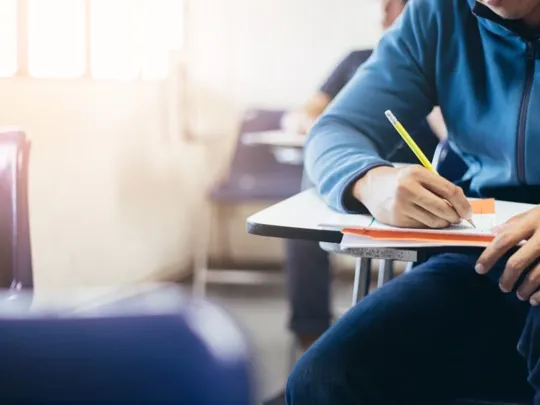 Someone sitting an exam paper.