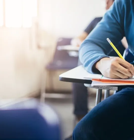 Someone sitting an exam paper.