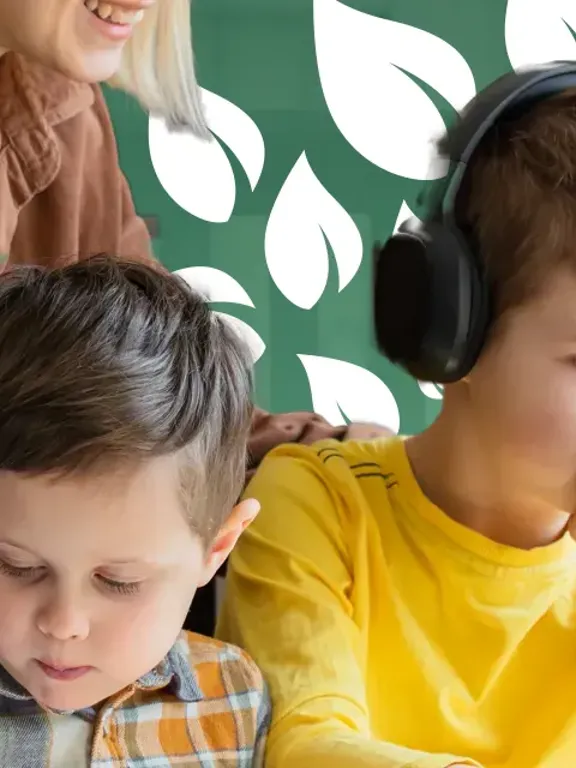 Mother guiding sons during home learning with laptop and written work