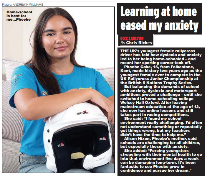 WHO student Phoebe photographed for a news article holding her helmet. 