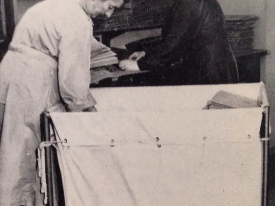 Two women preparing lessons for posting to all corners of the world.