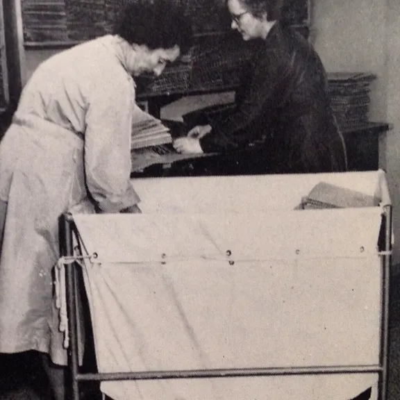 Two women preparing lessons for posting to all corners of the world.