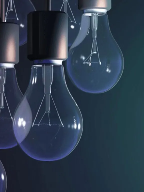 A cluster of unlit, classic filament light bulbs hangs on the left side of the image, while on the right, a single, glowing spiral-shaped fluorescent bulb stands out against a dark background, representing a unique idea or a new way of thinking.