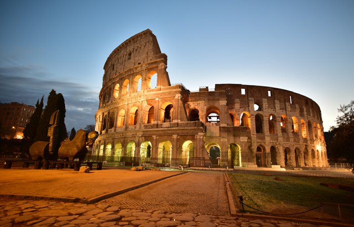 Landscape view of the Roman Colosseum at night. 