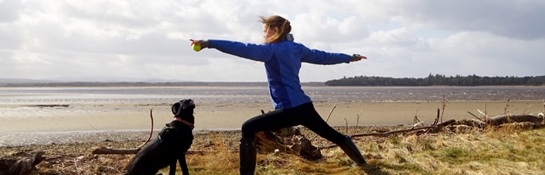 Saffron doing yoga on the beach. 