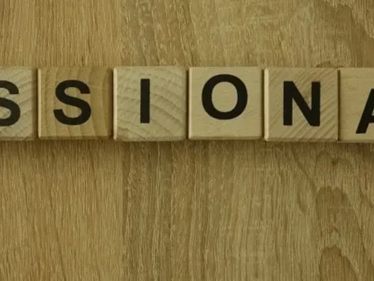 The word 'missionary' spelled out on wooden letters.