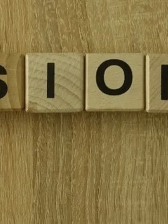 The word 'missionary' spelled out on wooden letters.