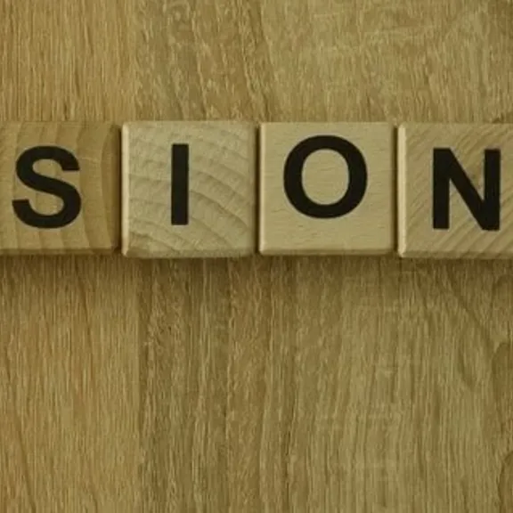 The word 'missionary' spelled out on wooden letters.